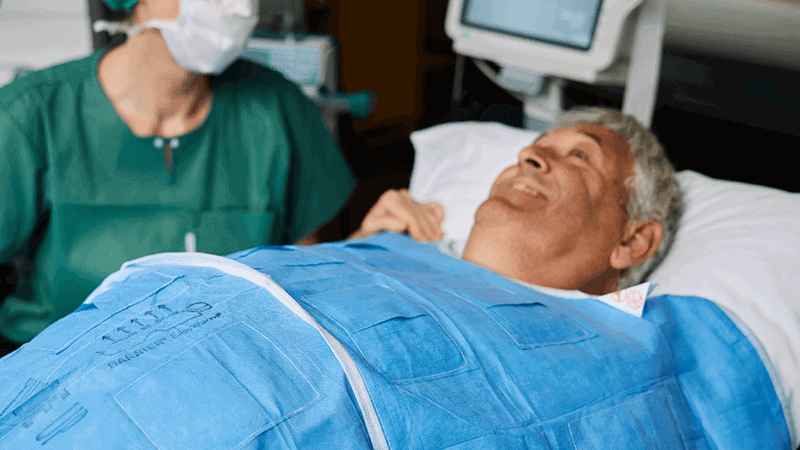 A photo of a surgeon talking to a patient before surgery.  