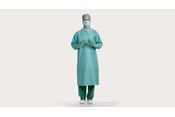 a male clinician wearing BARRIER surgical gown classic