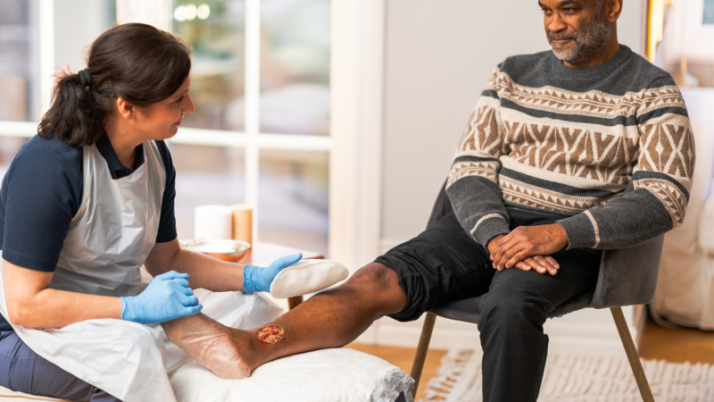 Health care professional using Mepi debripad debridement solution on a male patient