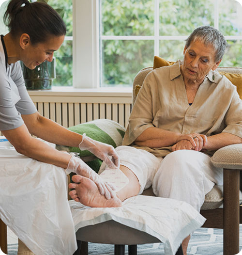 Healthcare professional applying Mepilex Up